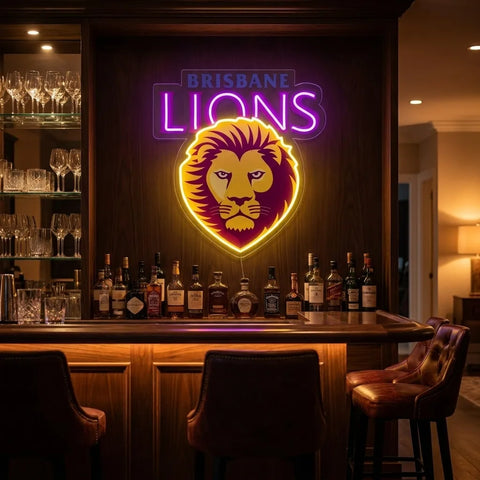 A glowing neon sign reading "BRISBANE LIONS" with a lion head emblem mounted above a wooden bar counter in a dimly lit bar interior.
